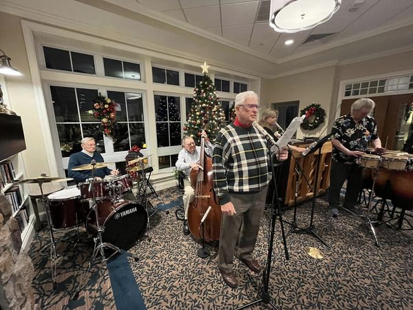 Sentimental Journey, The Village at Penn State's resident band, performs a festive sing-along holiday happy hour in the Club Lounge